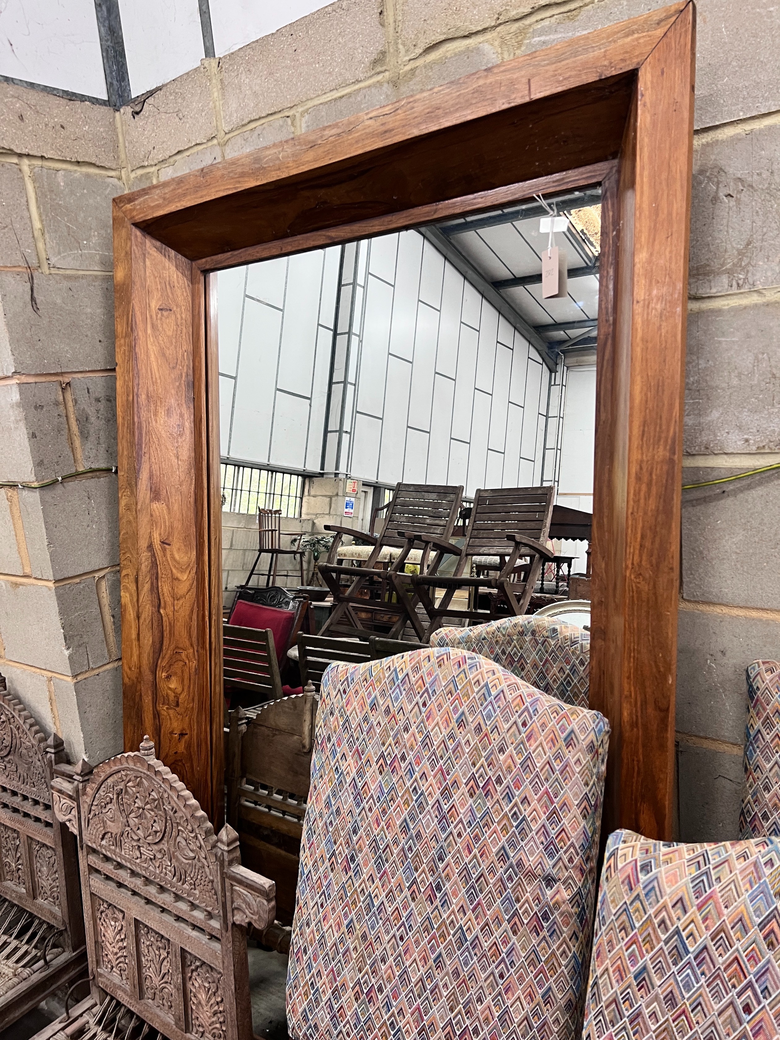 A heavy teak framed mirror, width 120cm, height 200cm *Please note the sale commences at 9am.